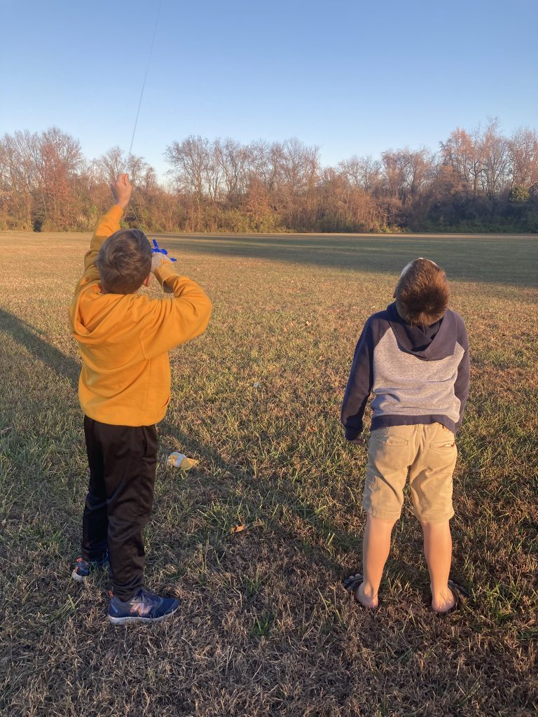 boys flying a kite